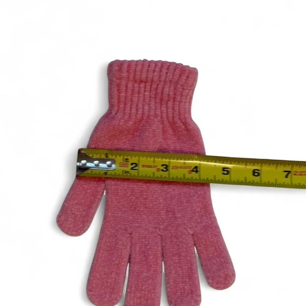 Pink knitted gloves with subtle speckled texture